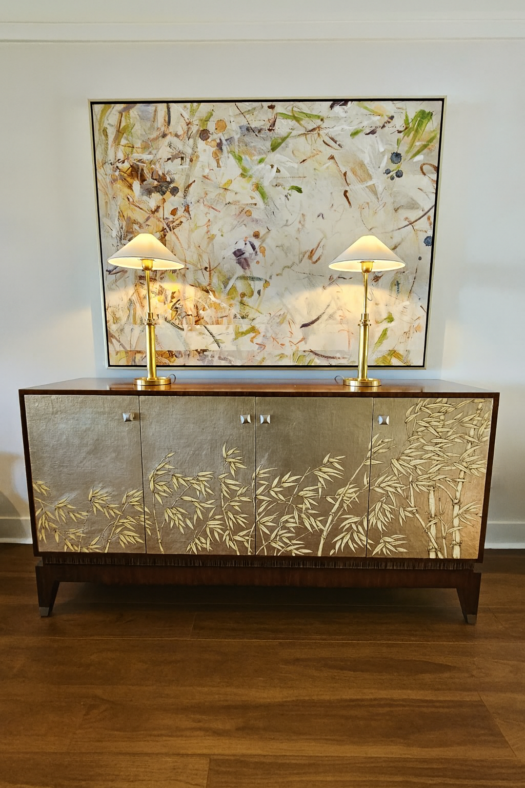 Buffet with bamboo motif and abstract artwork